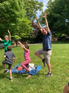 Adult an children stretching/playing